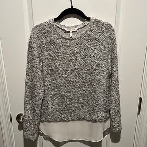 BCBG generation white and black sweater top with sheer detail at bottom